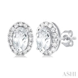 5x3 MM Oval Shape White Topaz and 1/8 Ctw Single Cut Diamond Halo Semi-Precious Stud Earrings in 14K White Gold