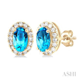 5x3 MM Oval Shape Blue Topaz and 1/8 Ctw Single Cut Diamond Halo Semi-Precious Stud Earrings in 10K Yellow Gold